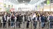 A large crowd flows through the turnstiles at the West Entrance of Messe München to electronica 2024