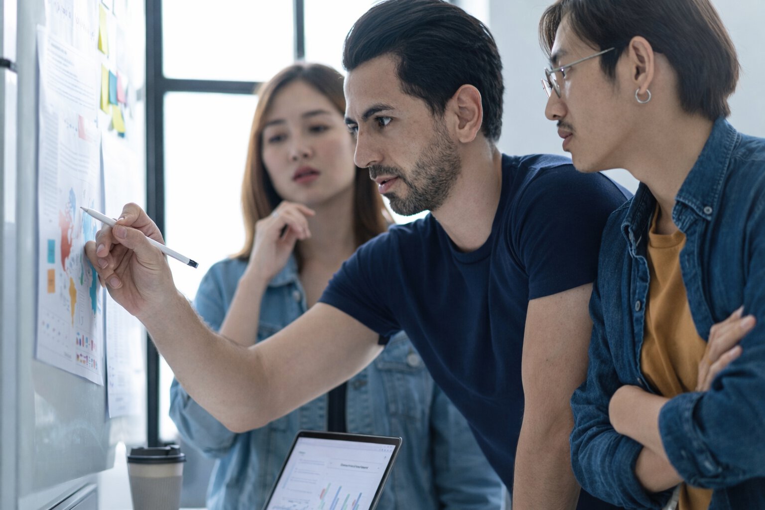 Team collaborating on a project analyzing data and developing concepts