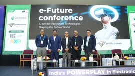 Five conference speakers stand on stage at the e-Future Conference during electronica India and productronica India. A large screen highlights AI-driven electronics and future technologies shaping the world.