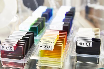 Rows of colorful square glass panes, each labeled with a code.