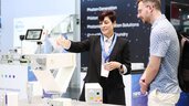 Fachgespräch am TRUMPF-Stand über photonische Systeme auf der Laser World of Photonics 2025 in München.