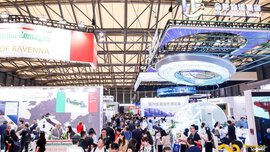Futuristically decorated exhibition stands at transport logistic CHINA with numerous visitors in between.