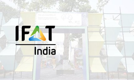Logo of IFAT India with a pale gray background photo of the trade fair building.