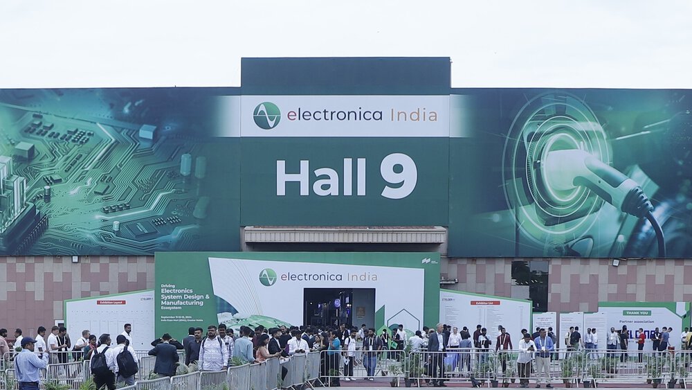 A crowd gathers in front of Hall 9 at electronica India, with banners and a visible entrance.
