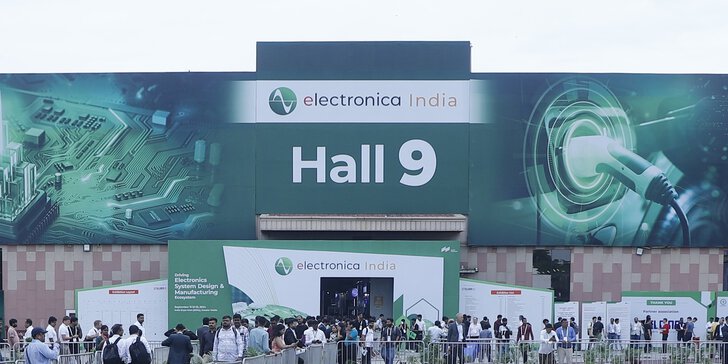 A crowd gathers in front of Hall 9 at electronica India, with banners and a visible entrance.