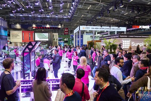 The well-attended exhibition hall B5, where visitors can view brightly lit stands and exhibitions.