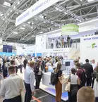 Many people look at an exhibition stand