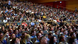 During the World of Photonics Congress, a large audience sits in an auditorium and looks ahead attentively.