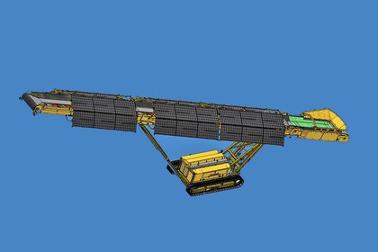 Model of a yellow conveyor belt machine with blue background from above.