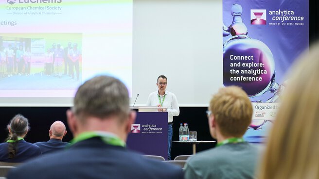 Presentation at a professional conference with an audience and slides