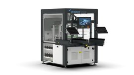 A rectangular machine with transparent window fronts and a black frame, various panels and a screen in front of it.