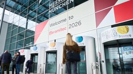 Entrance of Messe München with “Welcome to ceramitec 2026” signage and visitors entering.