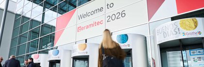 Entrance of Messe München with “Welcome to ceramitec 2026” signage and visitors entering.