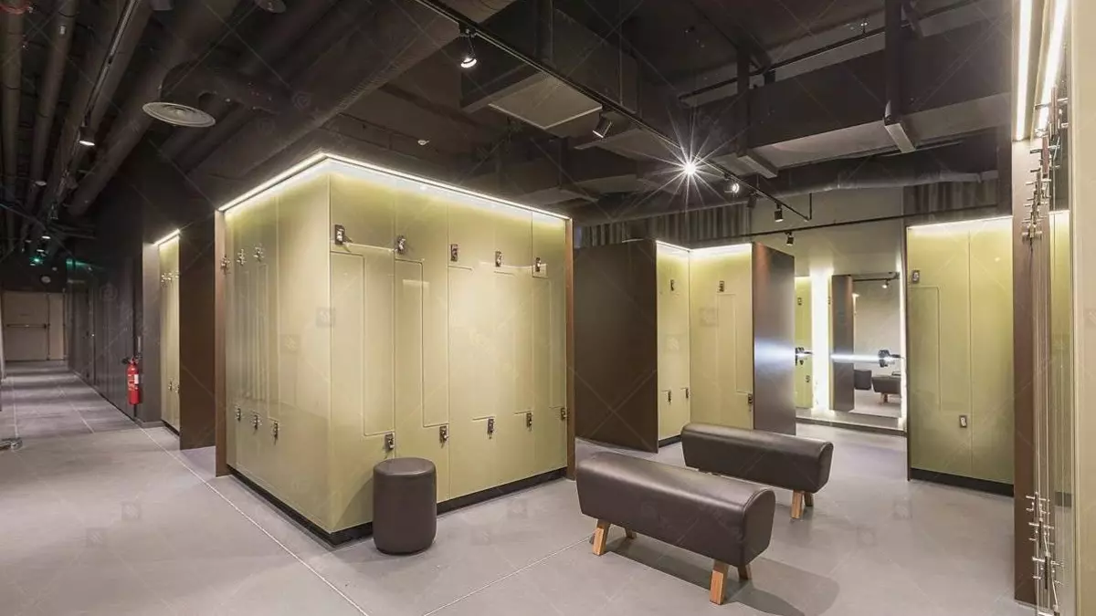 120 modern lockers with colored MDF and CNC-cut glass doors featuring ceramic enamel. The space-maximizing design includes hanger bars, ventilation, shelves, and LED lighting for comfort.